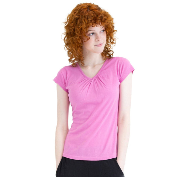 Woman wearing a pink t-shirt on a white background